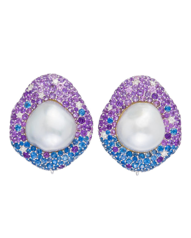 South Sea pearl button earrings surrounded by blue and purple sapphires, amethyst and diamonds, crafted in 18 karat white gold