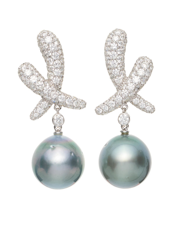 Tahitian pearl and diamond ‘Kiss’ drop earrings, crafted in 18 karat white gold.