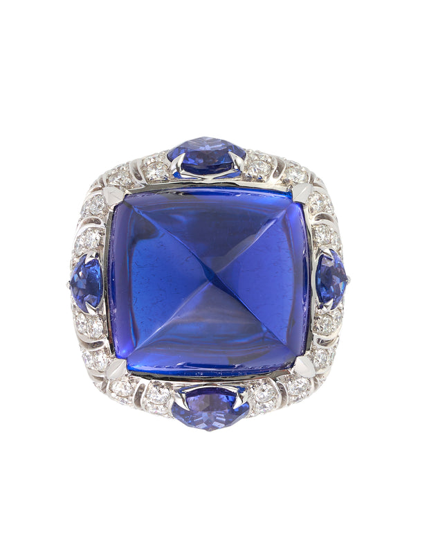 Cabochon tanzanite ring set with diamonds, crafted in 18 karat white gold.