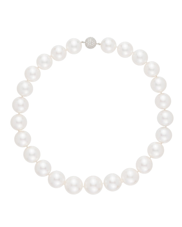 Australian South Sea pearl strand set with a diamond ball clasp, crafted in 18 karat white gold.
