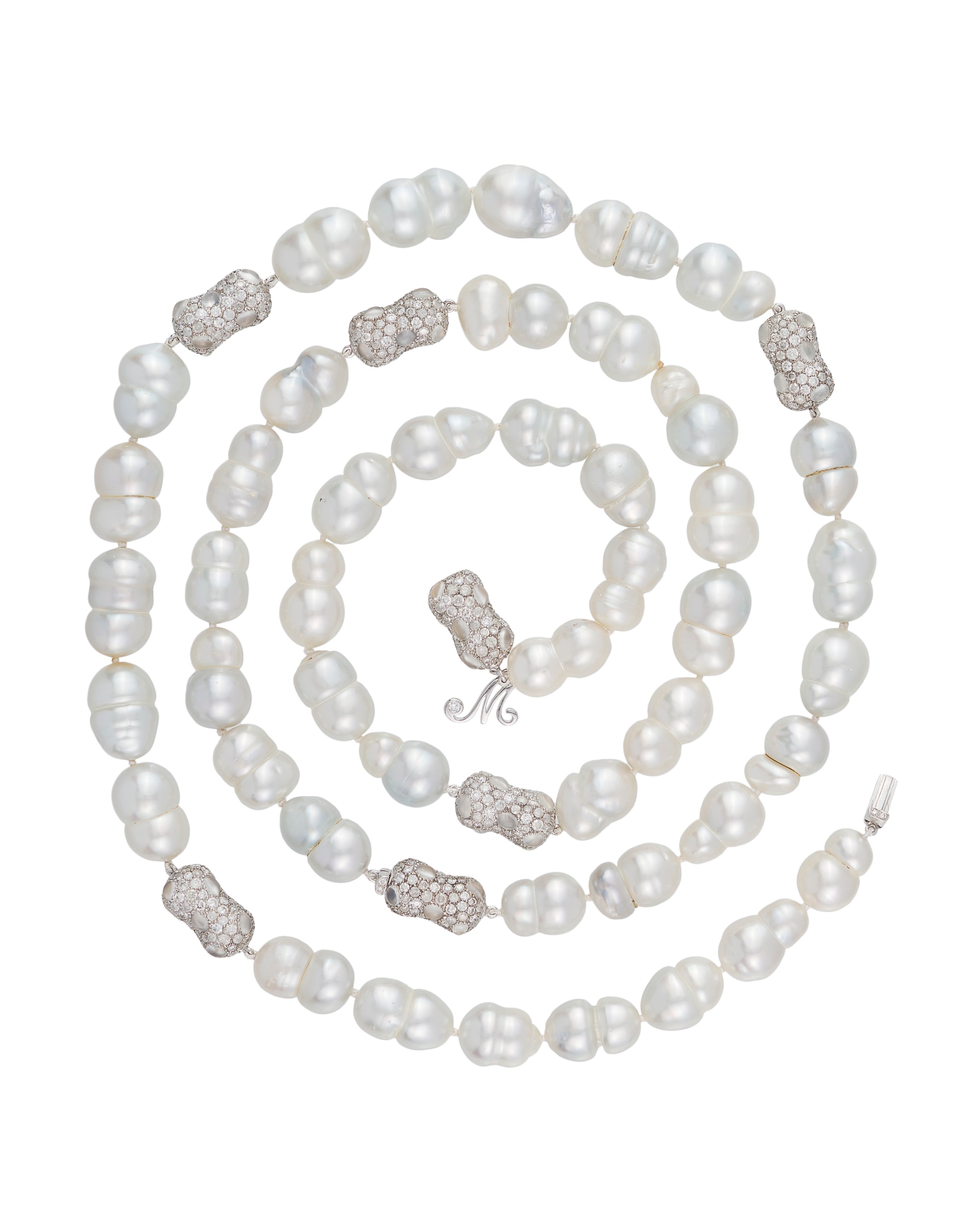 "Snowmen" South Sea pearl necklace with diamond and moonstone 'peanut' enhancers, crafted in 18 karat white gold.