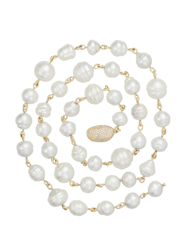 Gold South Sea pearl necklace featuring grey white and golden tone Australian baroque pearls and pave diamond 'pebble' set with diamonds, crafted in 18 karat yellow gold.