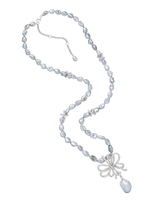 Tahitian keshi pearl necklace with diamond bow, crafted in 18 karat white gold