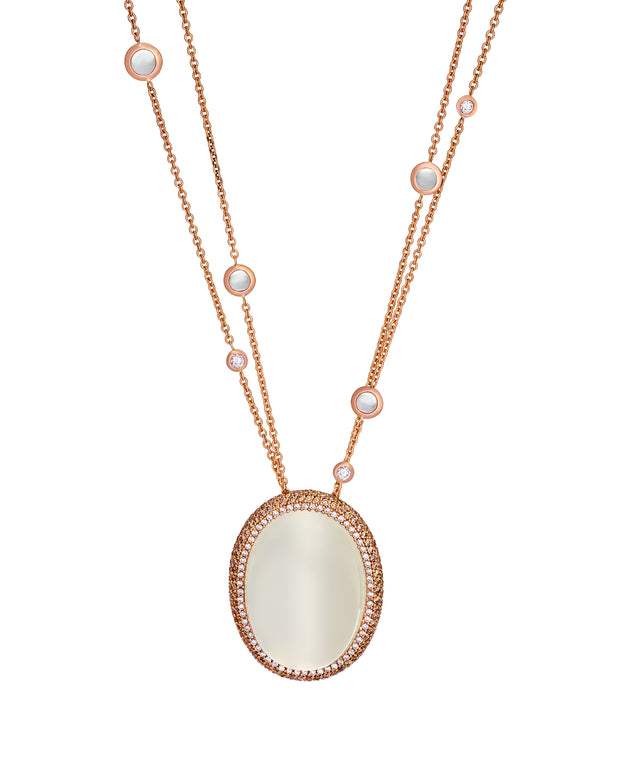 Moonstone pendant surrounded by diamonds, dropping from an 18 karat rose gold chain with diamonds and moonstones.