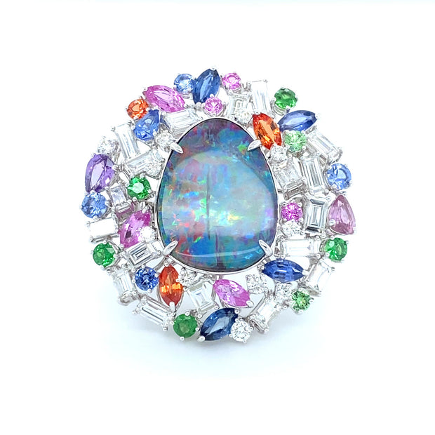 Opal ring, featuring a natural Queensland boulder opal, surrounded by a myriad of gemstones, crafted in 18 karat white gold.