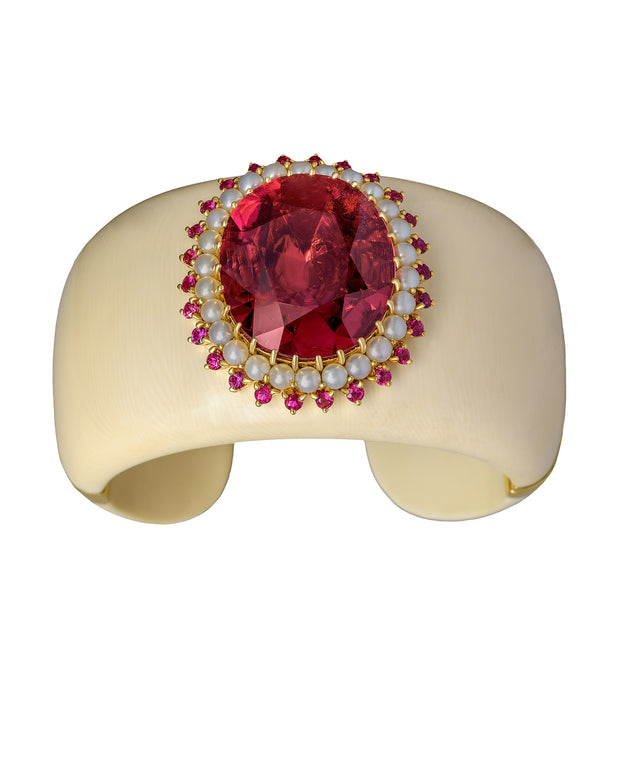Mammoth ivory cuff set with a centre rubellite, surrounded by Australian South Sea pearls and rubies, crafted in 18 karat yellow gold.