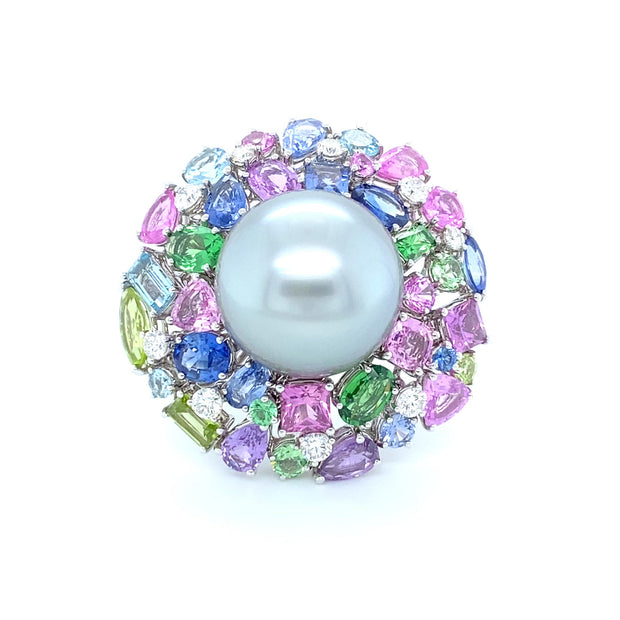 Tahitian pearl ring surounded by a myriad of gemstones, crafted in 18 karat white gold.